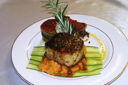 Pepper Filet Mignon Over a Bed of Root Mash Potatoes and Crusted Tapenade Sea Bass with Red Bell Pepper Coulis