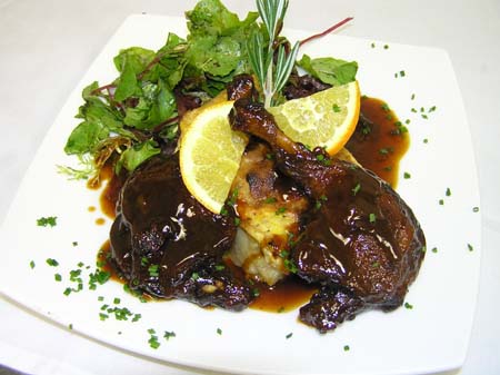 Orange Duck over a Potato Gratin